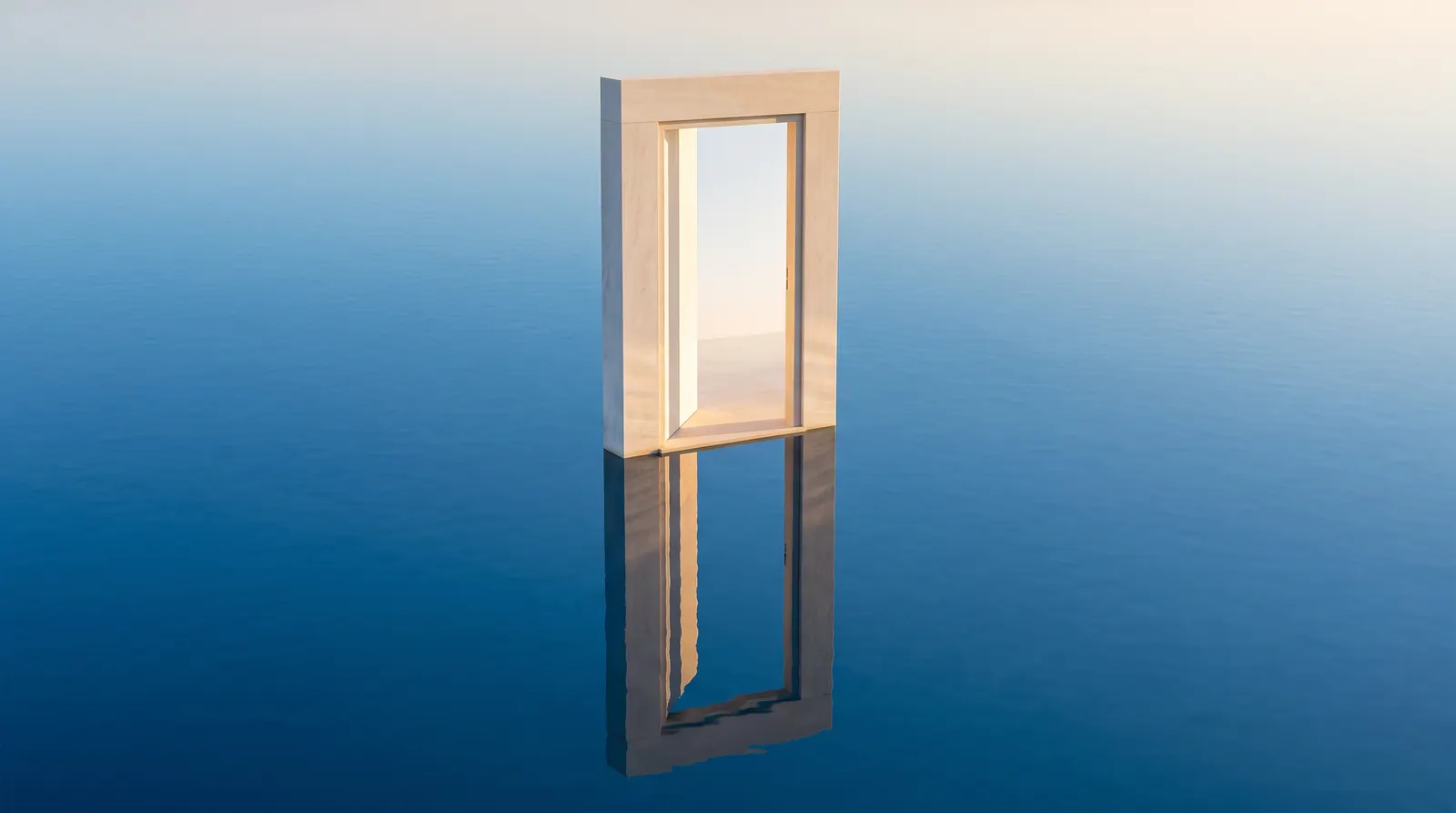 A pale door frame standing open on still blue water, mirrored in the surface, warm sky showing through